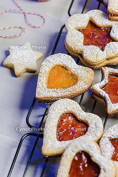 Homebaked Christmas Cookies With fruit Jam filling and Icing Sugar [IBR124817841]