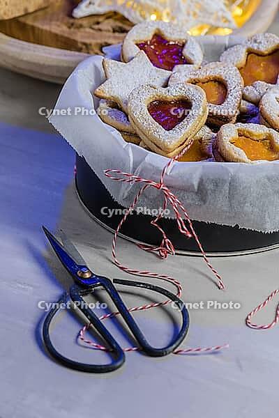 Homebaked Christmas Cookies With fruit Jam filling and Icing Sugar [IBR124817851]
