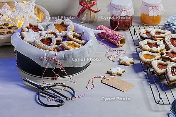 Homebaked Christmas Cookies With fruit Jam filling and Icing Sugar [IBR124817856]