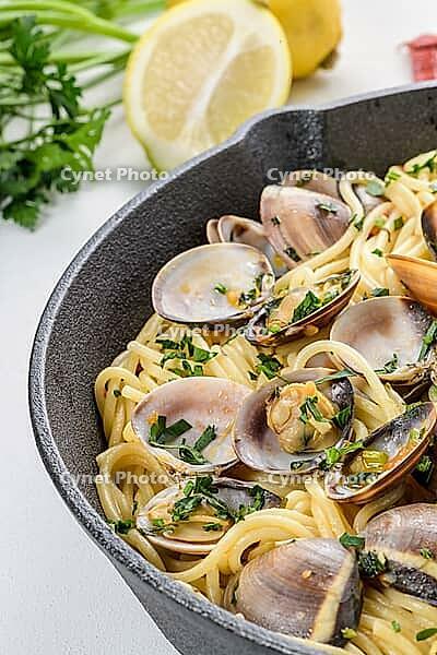 Traditional italian seafood pasta with clams Spaghetti alle Vongole [IBR124817863]
