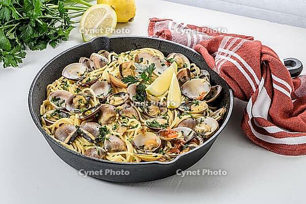 Traditional italian seafood pasta with clams Spaghetti alle Vongole [IBR124817864]