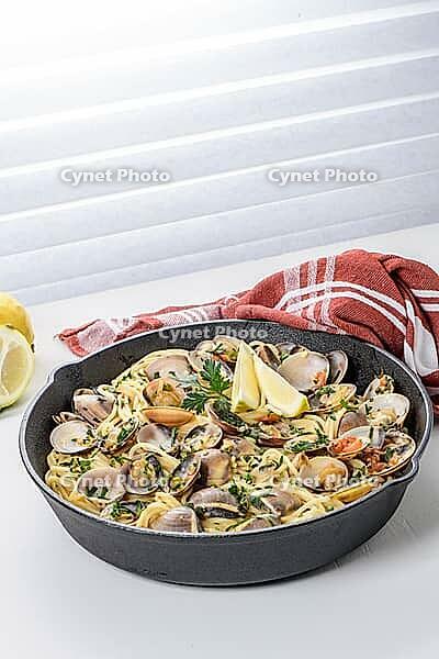 Traditional italian seafood pasta with clams Spaghetti alle Vongole [IBR124817866]