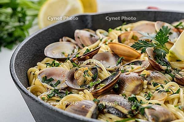 Traditional italian seafood pasta with clams Spaghetti alle Vongole [IBR124817879]