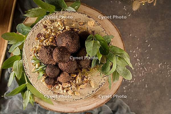 Delicious naked coffee and hazelnuts cake on table rustic wood kitchen countertop [IBR124817912]