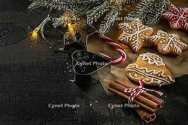 Baked Christmas cookies on rustic dark background [IBR124817929]