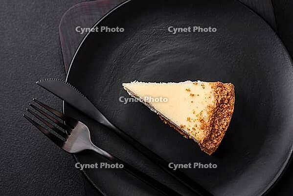 Food, Delicious sweet cheesecake cake on textured concrete background. Delicious breakfast dessert [IBR124842012]