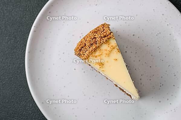 Food, Delicious sweet cheesecake cake on textured concrete background. Delicious breakfast dessert [IBR124842019]