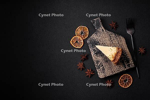 Food, Delicious sweet cheesecake cake on textured concrete background. Delicious breakfast dessert [IBR124842021]