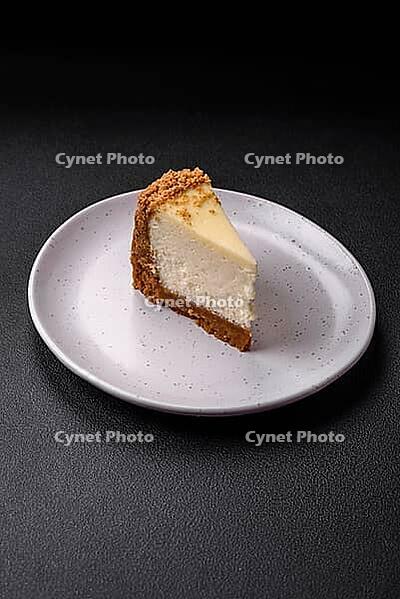 Food, Delicious sweet cheesecake cake on textured concrete background. Delicious breakfast dessert [IBR124842024]