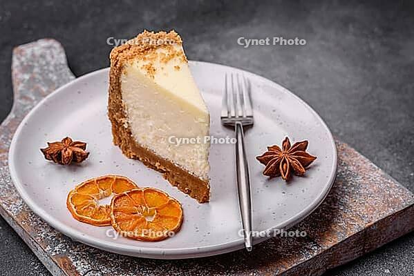 Food, Delicious sweet cheesecake cake on textured concrete background. Delicious breakfast dessert [IBR124842030]