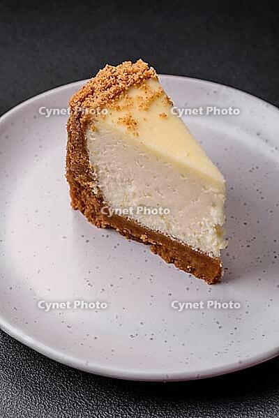 Food, Delicious sweet cheesecake cake on textured concrete background. Delicious breakfast dessert [IBR124842031]