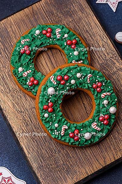 Food, Beautiful festive Christmas gingerbread made by hand with decoration elements on a dark concrete background [IBR124842040]