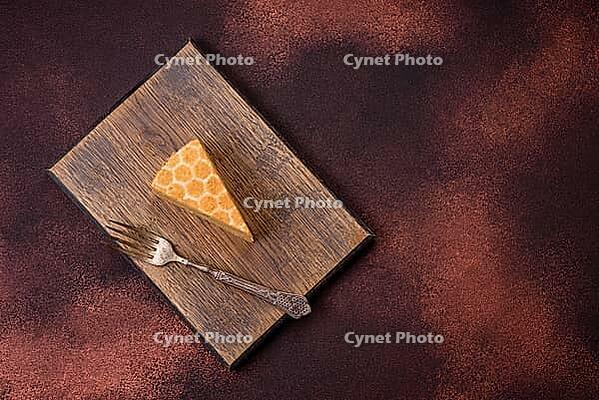 Food, Delicious fresh sweet honey cake layer cake with white cream on textured concrete background [IBR124842109]