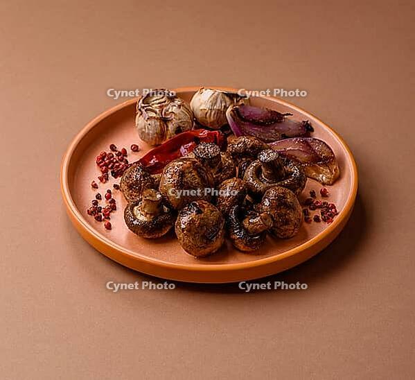 Grilled mushroom pieces, a vegetarian healthy meal with sauce. Barbecue mushroom halves as a food backdrop for your design [IBR124865229]