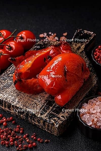 Grilled red bell peppers, vegetarian food. Red bell peppers as a food background for your design [IBR124865230]