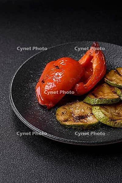 Grilled red bell peppers, vegetarian food. Red bell peppers as a food background for your design [IBR124865231]