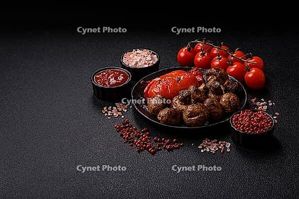 Grilled mushroom pieces, a vegetarian healthy meal with sauce. Barbecue mushroom halves as a food backdrop for your design [IBR124865235]