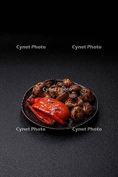 Grilled mushroom pieces, a vegetarian healthy meal with sauce. Barbecue mushroom halves as a food backdrop for your design [IBR124865236]