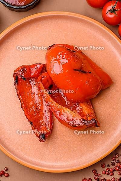 Grilled red bell peppers, vegetarian food. Red bell peppers as a food background for your design [IBR124865249]