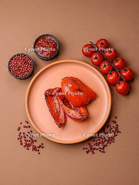 Grilled red bell peppers, vegetarian food. Red bell peppers as a food background for your design [IBR124865251]