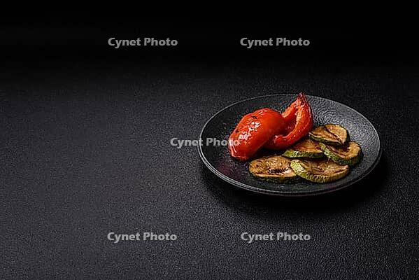 Grilled red bell peppers, vegetarian food. Red bell peppers as a food background for your design [IBR124865279]