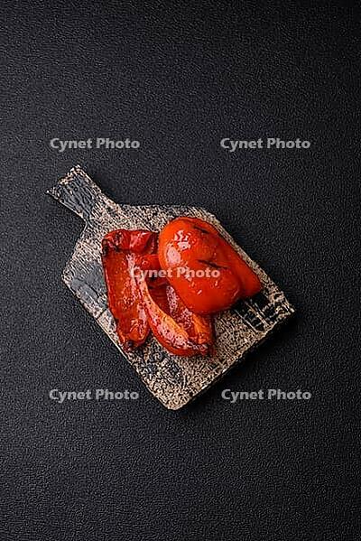 Grilled red bell peppers, vegetarian food. Red bell peppers as a food background for your design [IBR124865286]