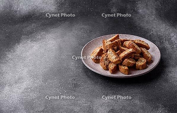 Italian cantuccini cookies with almonds, a sweet biscuit dessert. Cantuccini cookies as a food backdrop for your design [IBR124865288]
