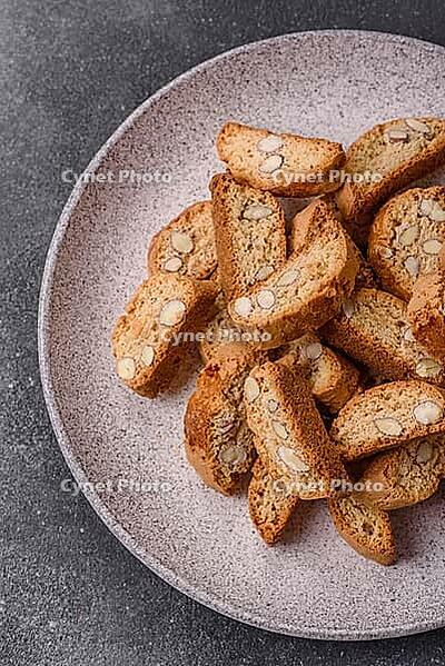 Italian cantuccini cookies with almonds, a sweet biscuit dessert. Cantuccini cookies as a food backdrop for your design [IBR124865289]