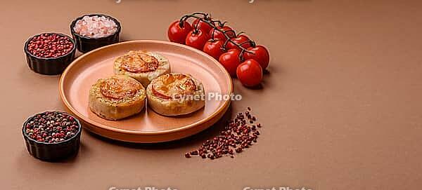 Round fish or chicken cutlets baked with tomato and cheese. Fish cutlets as a food backdrop for your design [IBR124865290]