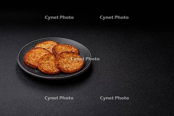 Potato hash browns, a cooked vegetable breakfast food. Potato hash browns as a food background for your design [IBR124865322]