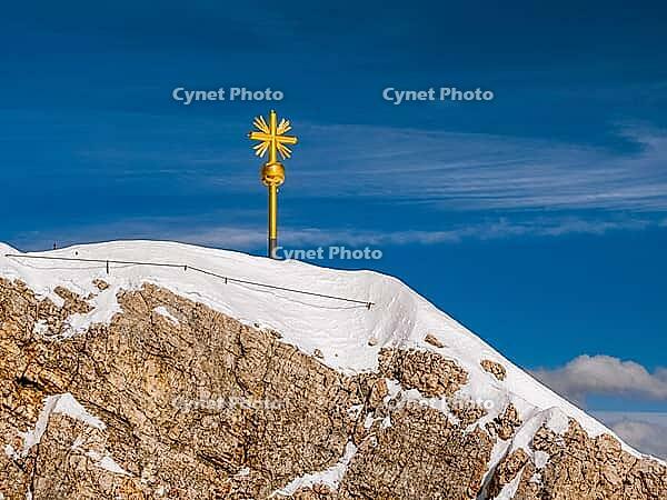 Summit cross on the Zugspitze, the highest mountain in Germany [IBR124898939]