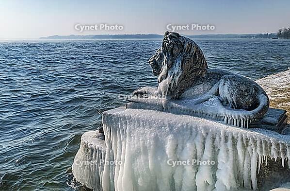 Bavarian lion covered in ice on an icy winter day in Tutzing am Starnberger See, Upper Bavaria, Bavaria, Germany [IBR124898951]