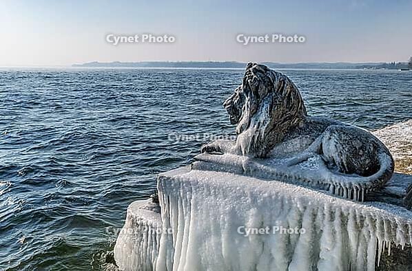 Bavarian lion covered in ice on an icy winter day in Tutzing am Starnberger See, Upper Bavaria, Bavaria, Germany [IBR124898953]