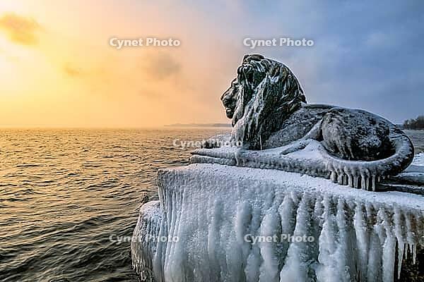 Bavarian lion covered in ice on an icy winter day in Tutzing am Starnberger See, Upper Bavaria, Bavaria, Germany [IBR124898954]