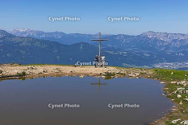 Landscape panorama, summit cross, mountains, lake, hiker, reflection, Tennengau, relaxation [IBR124899491]