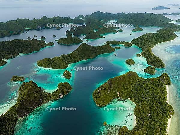 Aerial view of many small tropical islands with turquoise water and exposed reefs, Pulau Wayag, Raja Ampat, West Papua, Indonesia [IBR124899559]
