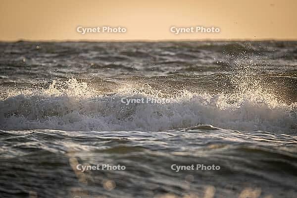 Surf, breaking wave against light, Sortebærdalen Strand, Houvig, North Sea, Denmark [IBR124899877]
