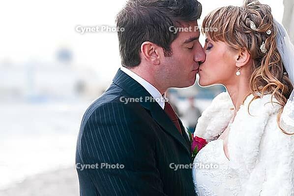 Just married couple is kissing at street [IBR124906371]