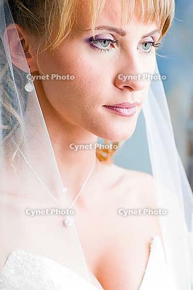 Beautiful bride is standing in wedding dress [IBR124906374]