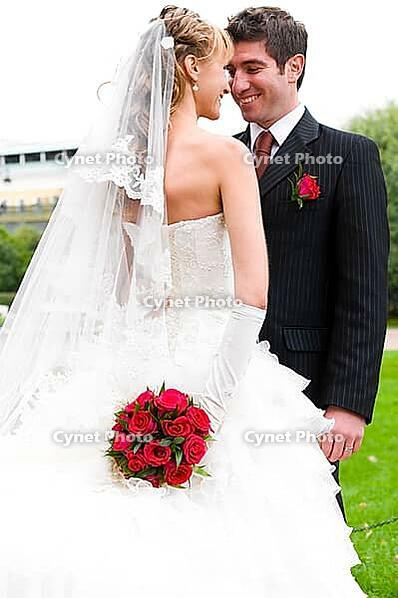 Bride is hiding her wedding bouquet from groom [IBR124906376]