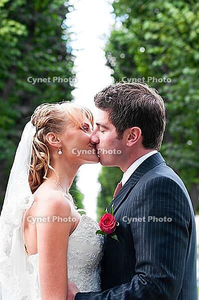 Just married couple is kissing at park [IBR124906378]
