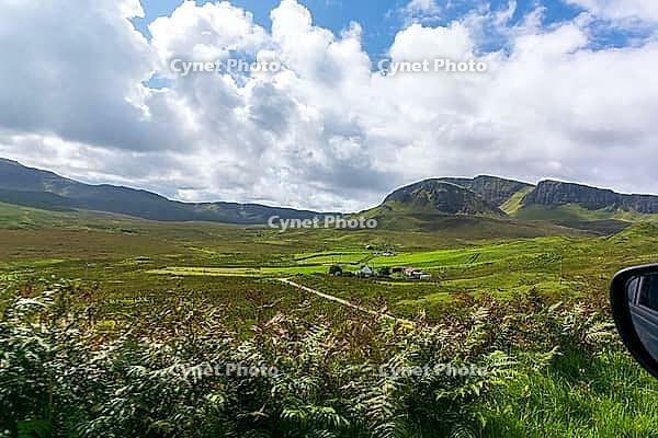 View of the Scottish Highlands, green meadows and cloudy skies in summer 2018 [IBR124915223]
