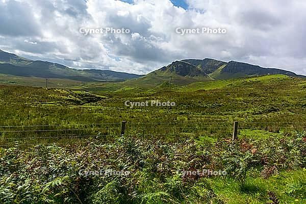 View of the Scottish Highlands, green meadows and cloudy skies in summer 2018 [IBR124915225]
