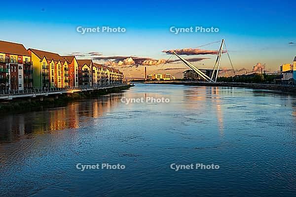 View over the river against buildings in evening sun, Newport in summer 2018 [IBR124915245]