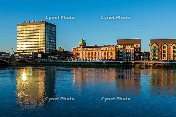 View over the river against buildings in evening sun, Newport in summer 2018 [IBR124915246]