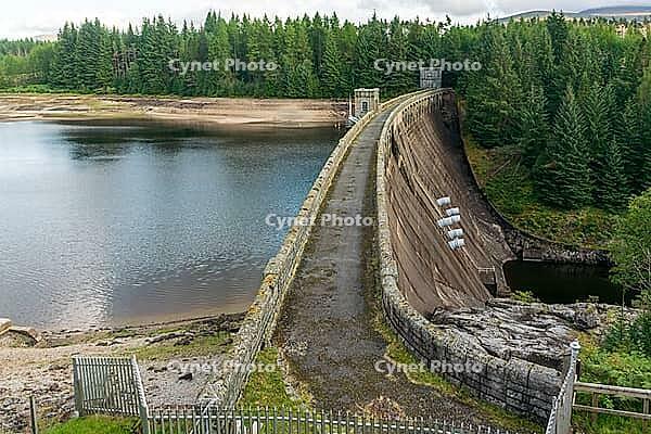 View from the lakeshore near the dam wall against a cloudy sky, near Aberchalda in summer 2018 [IBR124915248]