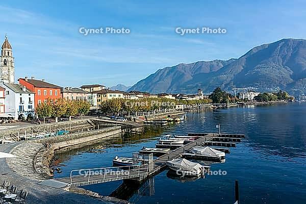 View of buildings on the lakeside against mountains [IBR124915251]