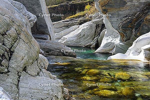 View of a creek surrounded by rocks [IBR124915253]