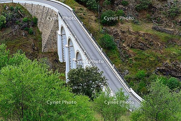 View from above of a valley with a bridge over a river in Mertola in spring 2019 [IBR124915274]