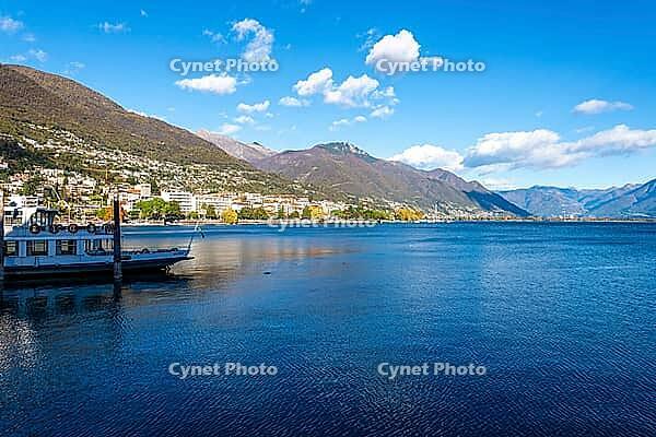 View of boats on a lake with mountains in the background [IBR124915281]